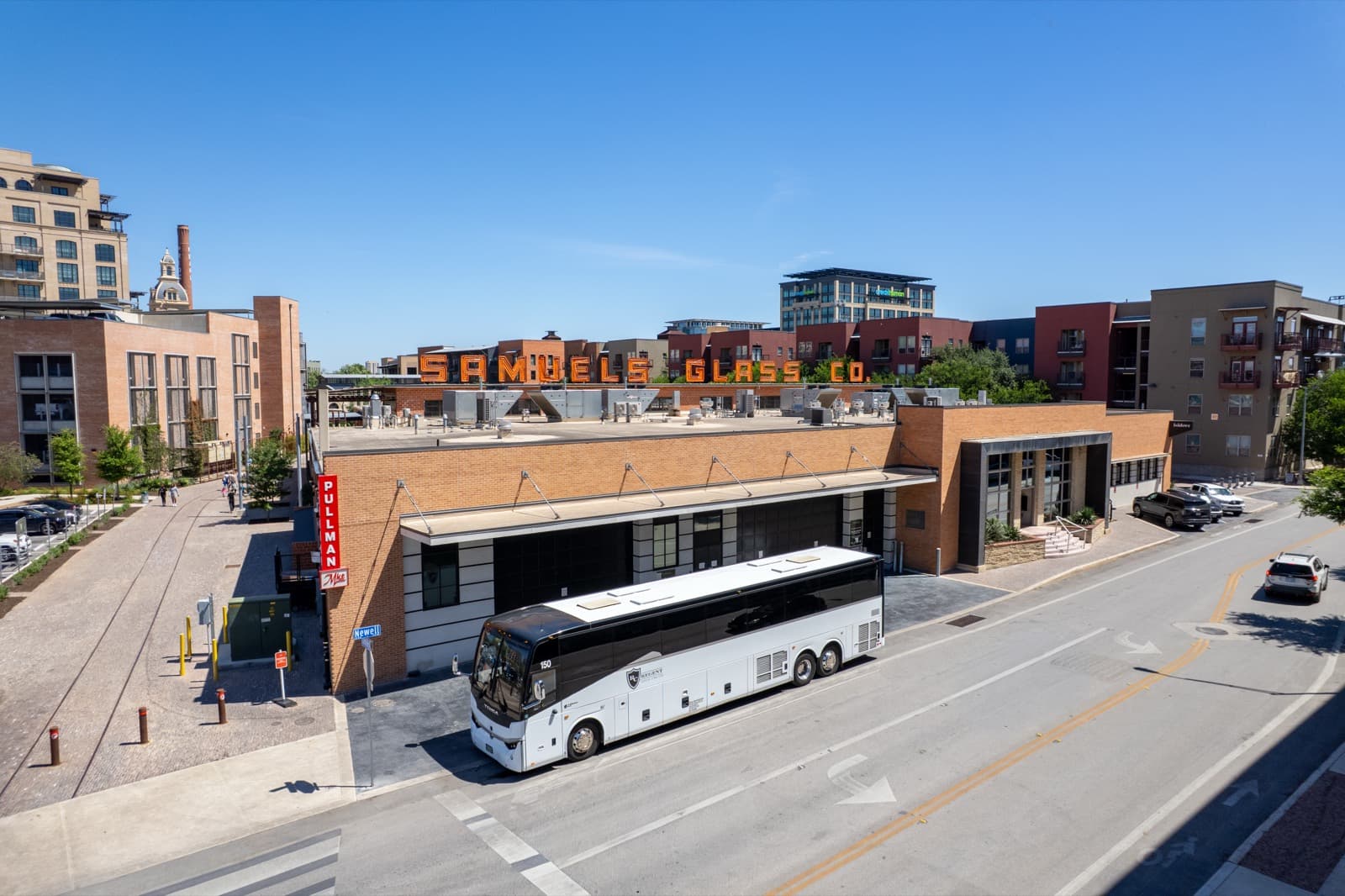 Tour bus on a downtown street in front of a historic building