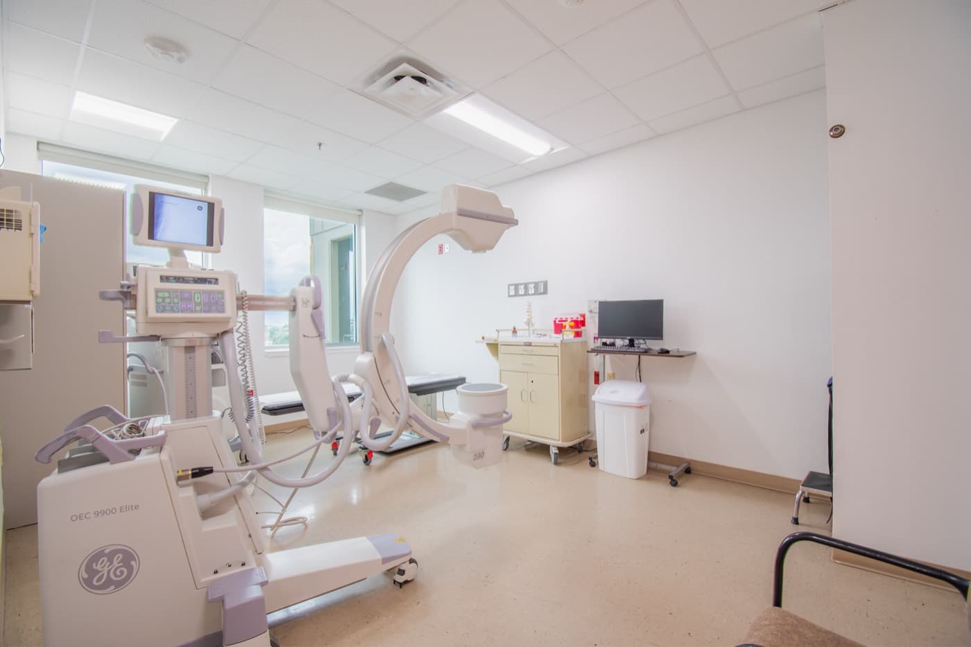 Medical imaging room with a C-arm X-ray unit
