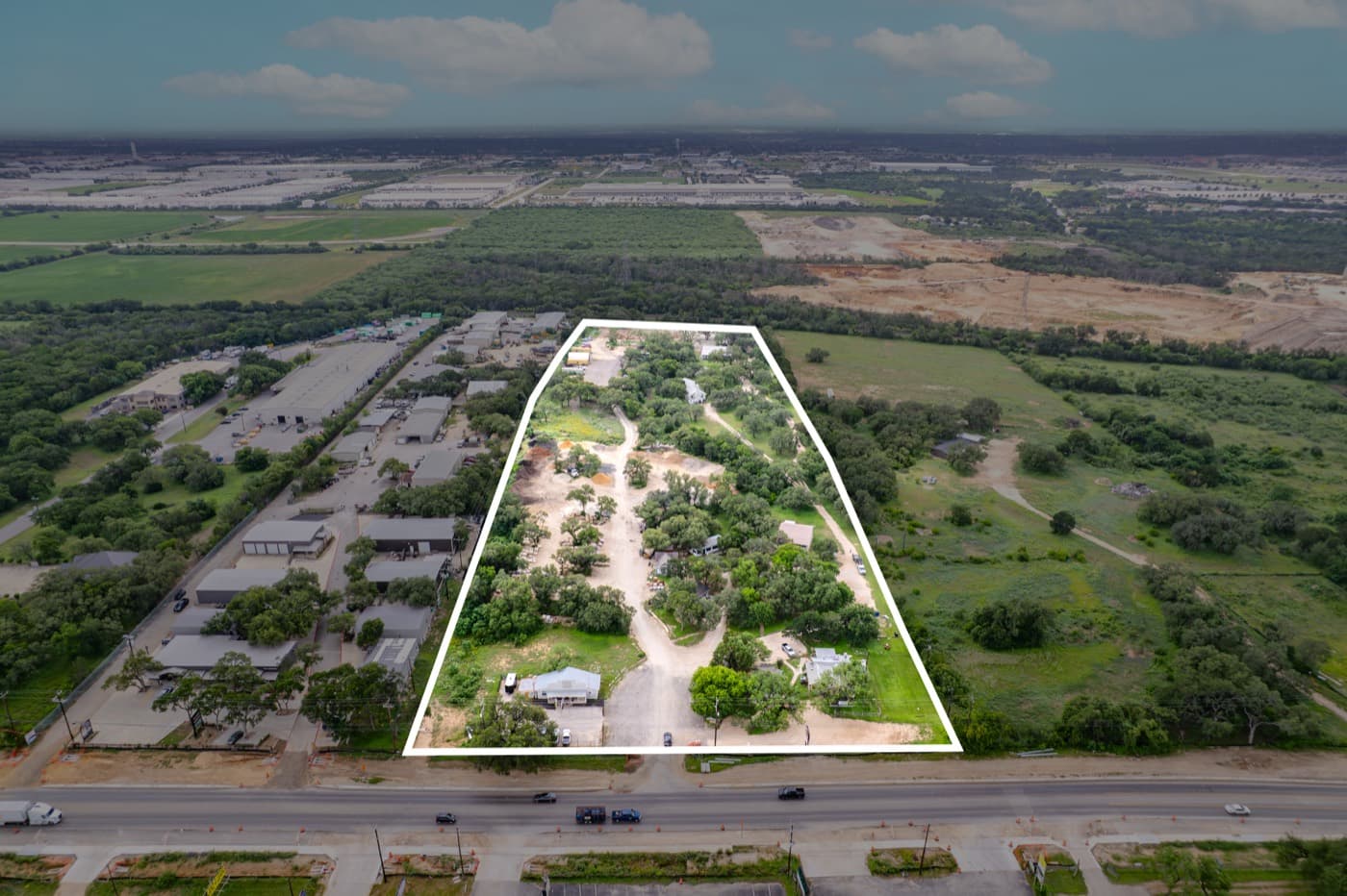 Aerial view of a land parcel outlined in white
