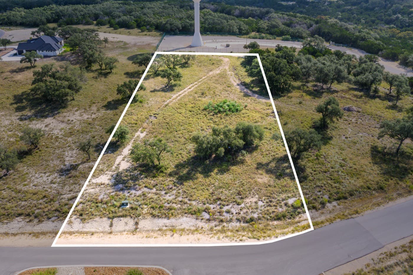 Aerial view of a residential lot outlined in white